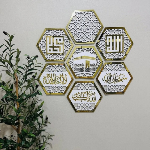Hexagonal wall art with intricate designs and text on a white wall.