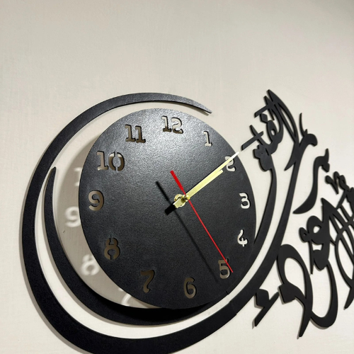 Decorative wall clock with Arabic calligraphy on a light background
