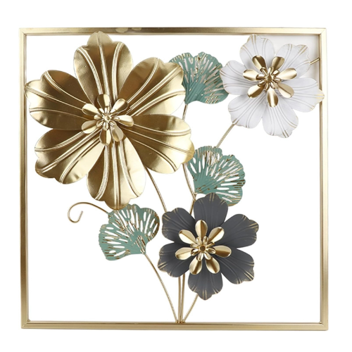 Decorative wall art with gold, green, and white flowers on a gold frame.