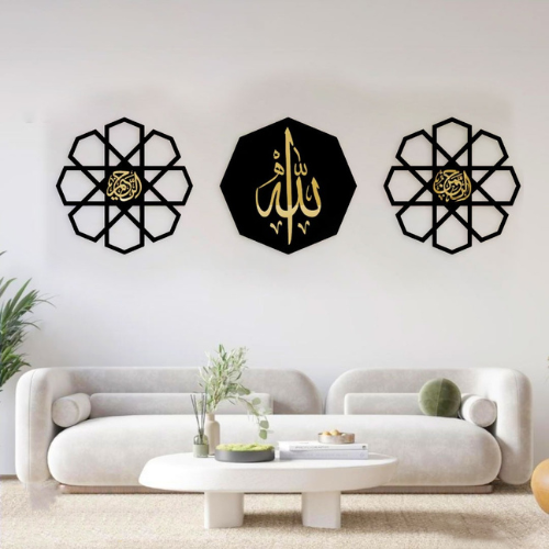 Decorative wall art pieces with geometric designs and Arabic calligraphy on a white wall.