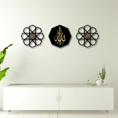 Decorative wall art pieces with floral designs and Arabic calligraphy on a white wall.