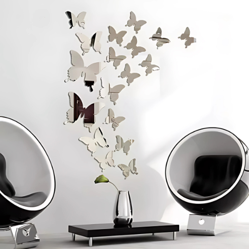 Butterfly mirror wall decals on a white wall with modern black and white furniture.