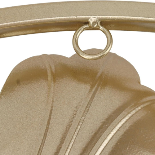 Close-up of a gold bell with a ring on a white background