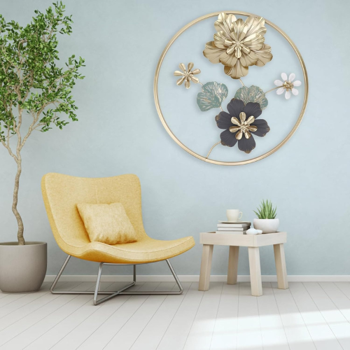Yellow armchair in a room with decorative floral wall art and a small table with plants.