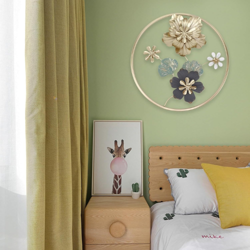 Bedroom with green wall, wooden headboard, and decorative floral wall art.