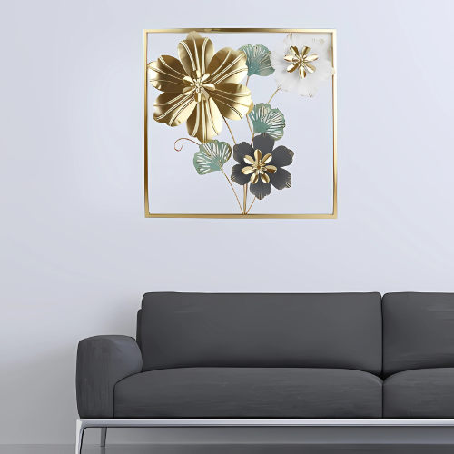 Decorative floral artwork with gold and green flowers in a gold frame above a gray sofa.