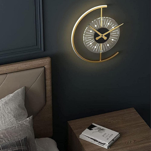 Decorative wall clock on a dark wall next to a bed and nightstand.