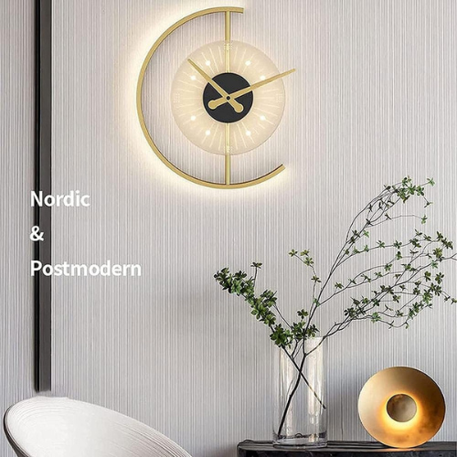 Modern wall clock with decorative elements on a light gray wall.