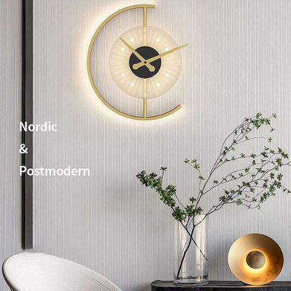 Modern wall clock with decorative elements on a light gray wall.